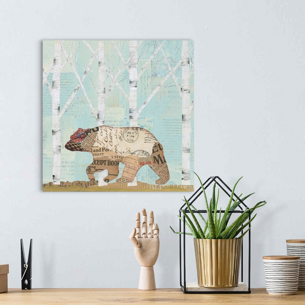 A bohemian room featuring Home decor artwork of a bear made from textiles and newsprint clippings against a pale blue fores...