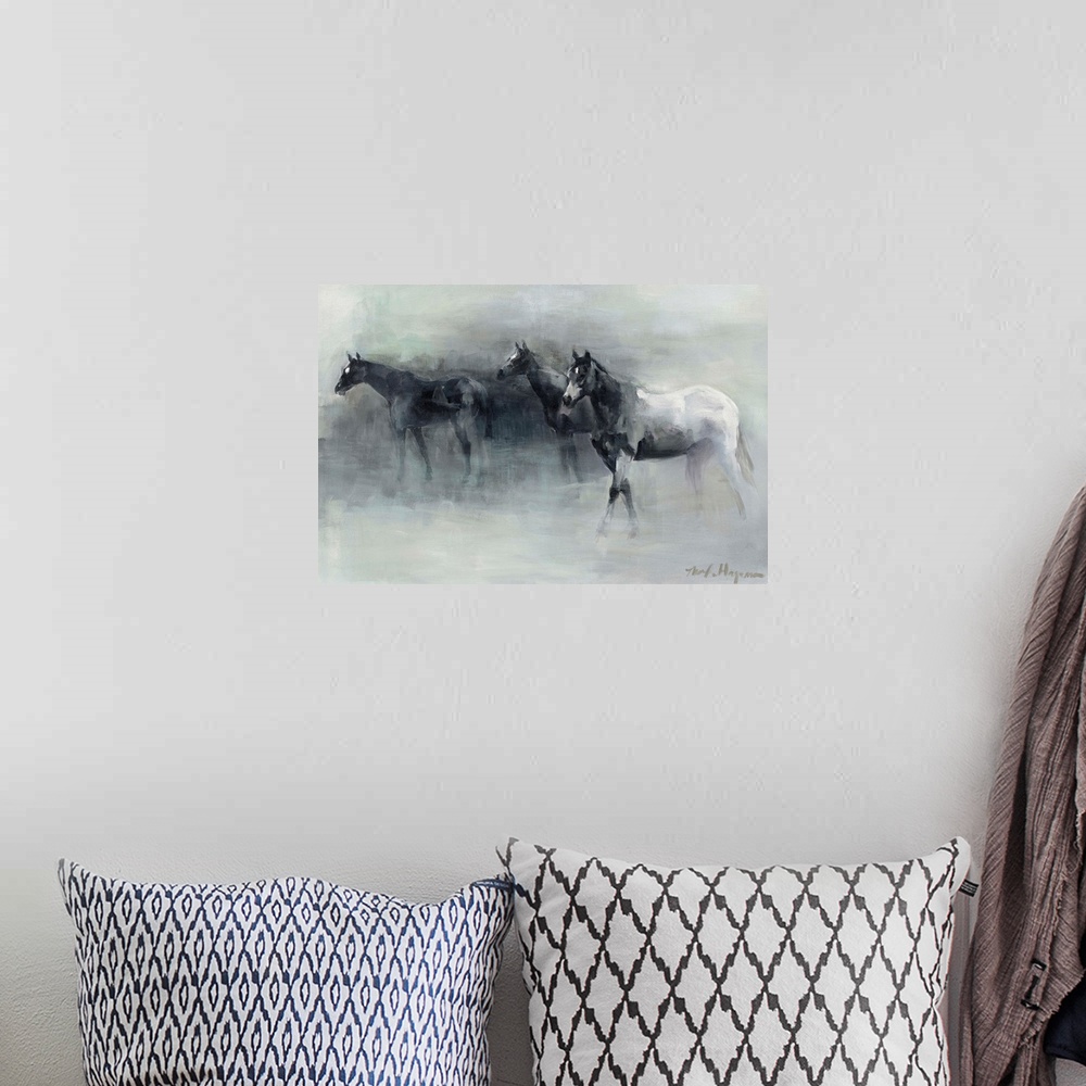 A bohemian room featuring Contemporary painting of three horses walking through the fog.