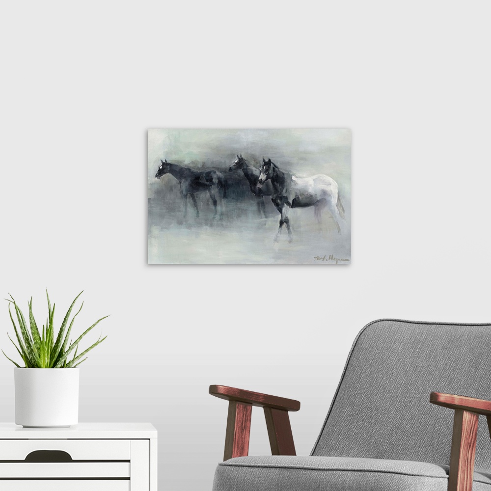 A modern room featuring Contemporary painting of three horses walking through the fog.