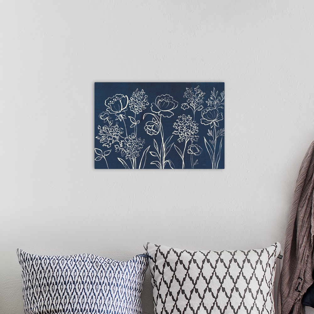 A bohemian room featuring White outlines of wildflowers on an indigo background.