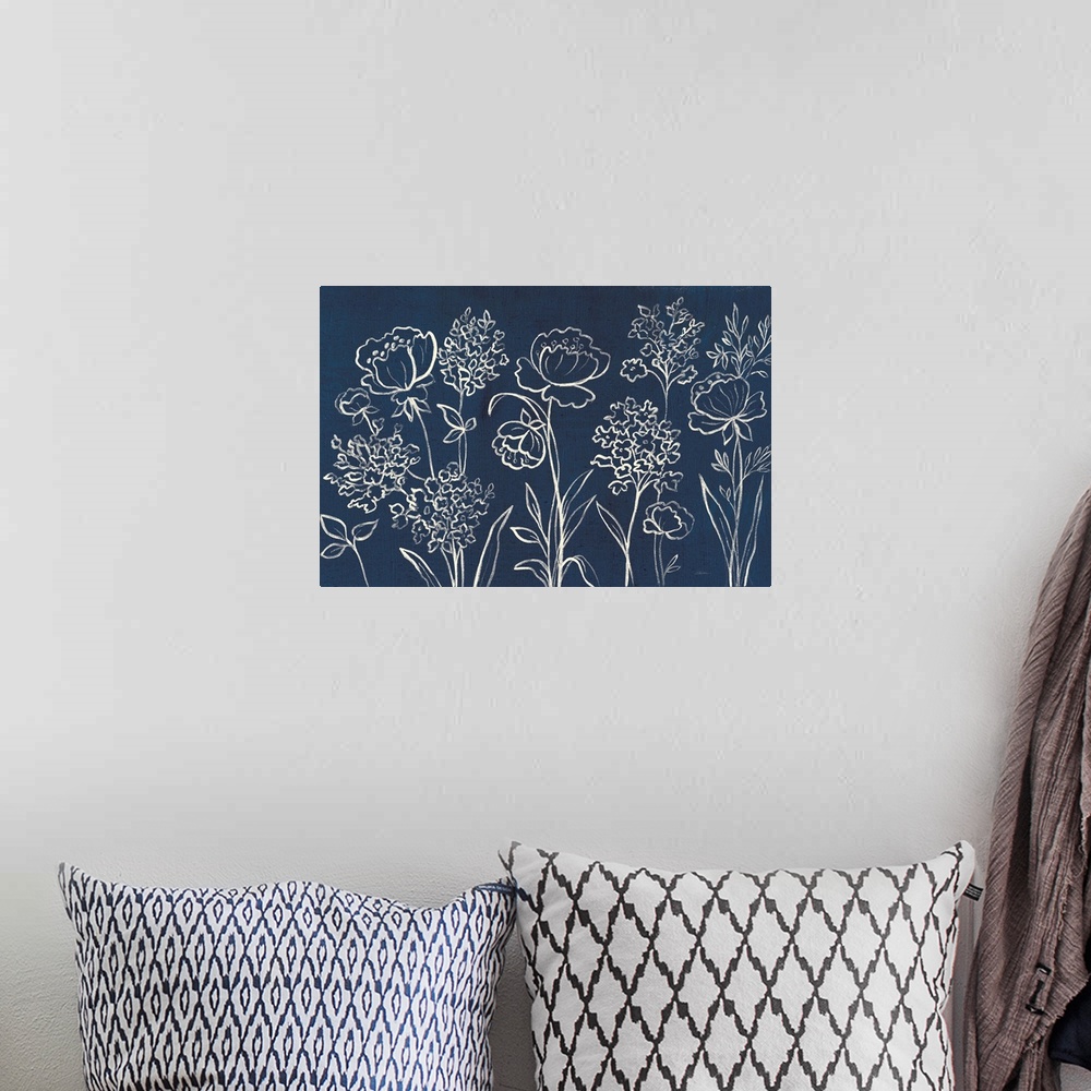 A bohemian room featuring White outlines of wildflowers on an indigo background.