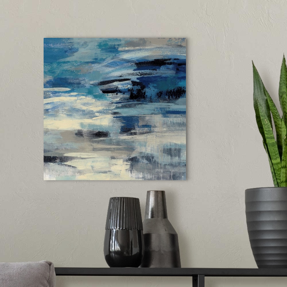 A modern room featuring Abstract artwork in stormy shades of blue.