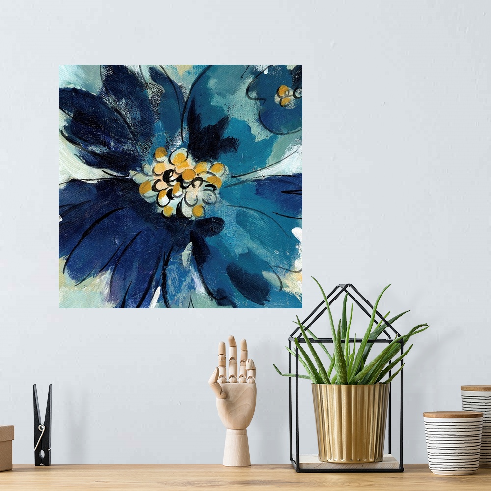 A bohemian room featuring Square painting of one large blue flower and part of a small blue flower, both with gold pistils.
