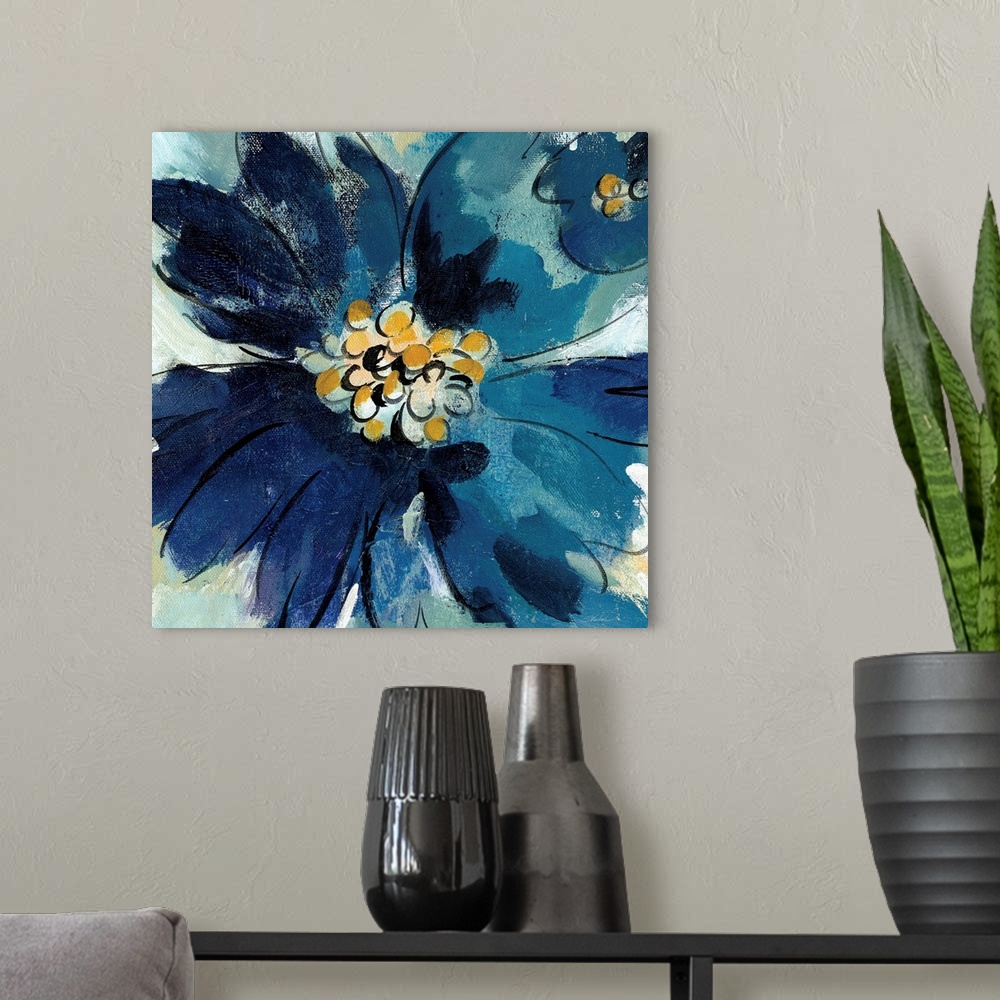 A modern room featuring Square painting of one large blue flower and part of a small blue flower, both with gold pistils.