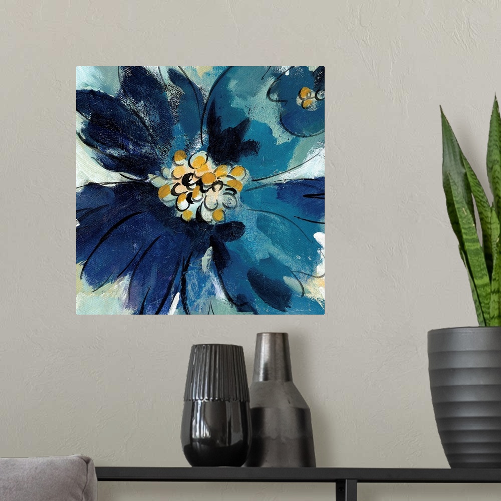A modern room featuring Square painting of one large blue flower and part of a small blue flower, both with gold pistils.