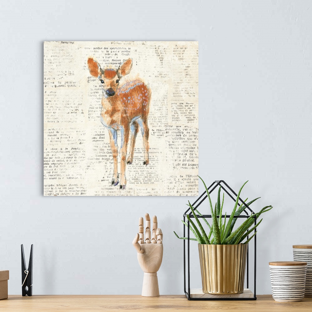 A bohemian room featuring Artwork of a fawn against a distressed newsprint background.