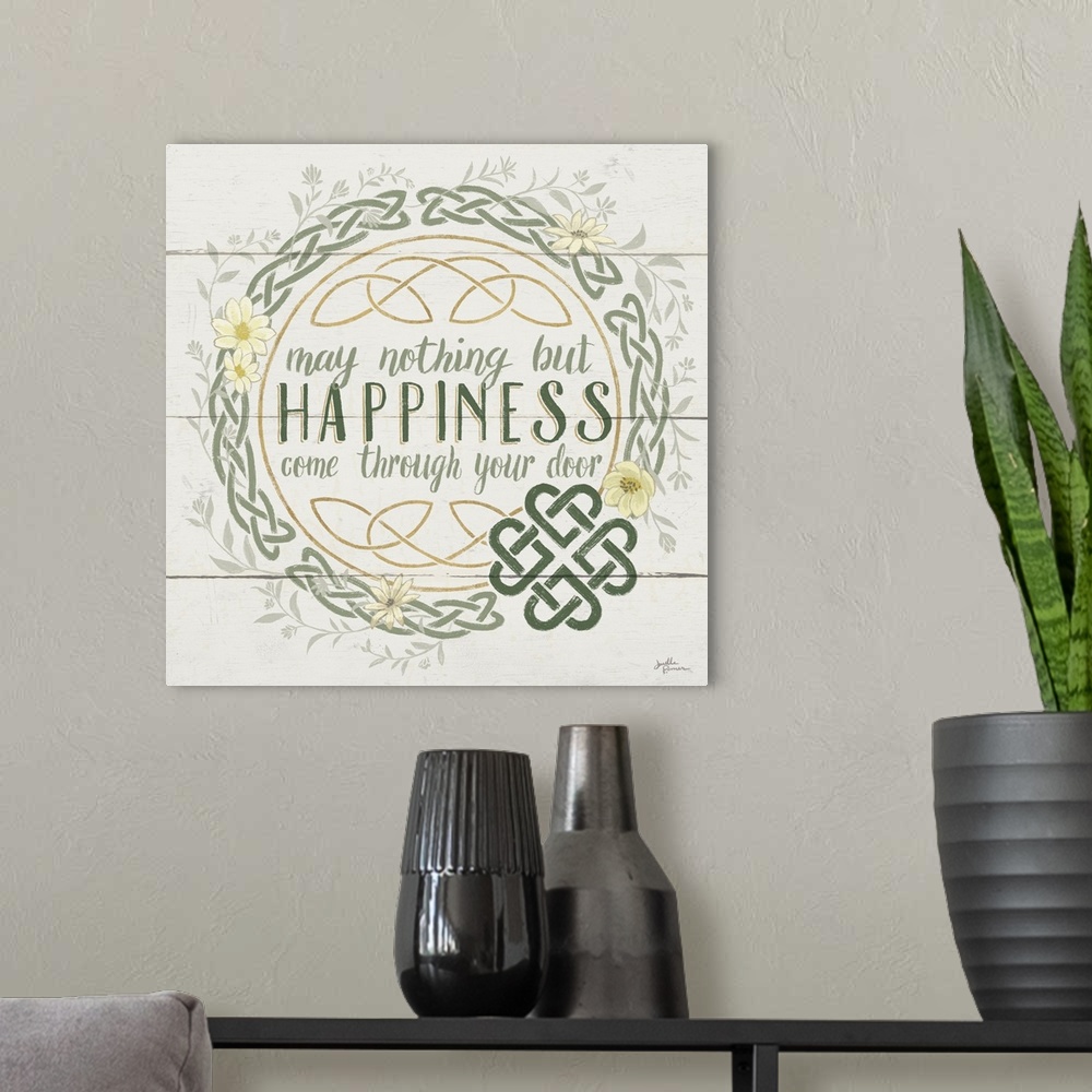 A modern room featuring "May Nothing But Happiness Come Through Your Door" inside a Celtic knot wreath, on a wood paneled...