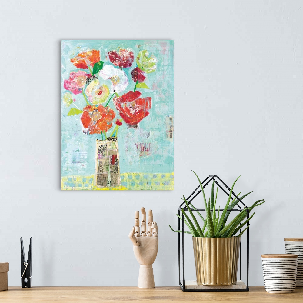 A bohemian room featuring Mixed media artwork creating colorful flowers in a vase made out of newspaper clippings on a ligh...