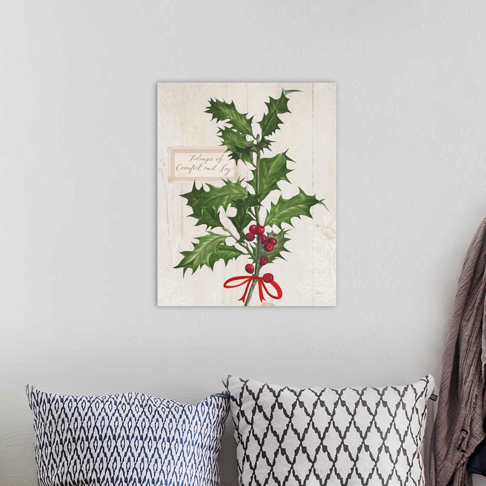 A bohemian room featuring Decorative artwork of holly with the words "Tidings of Comfort and Joy" on a white wood background.