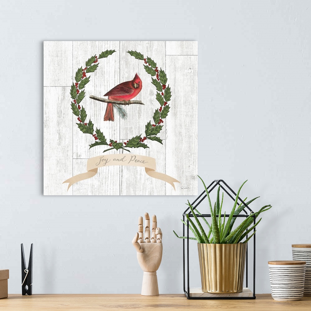 A bohemian room featuring Decorative artwork of a cardinal surrounded by a wreath of holly with the words "Joy and Peace" b...