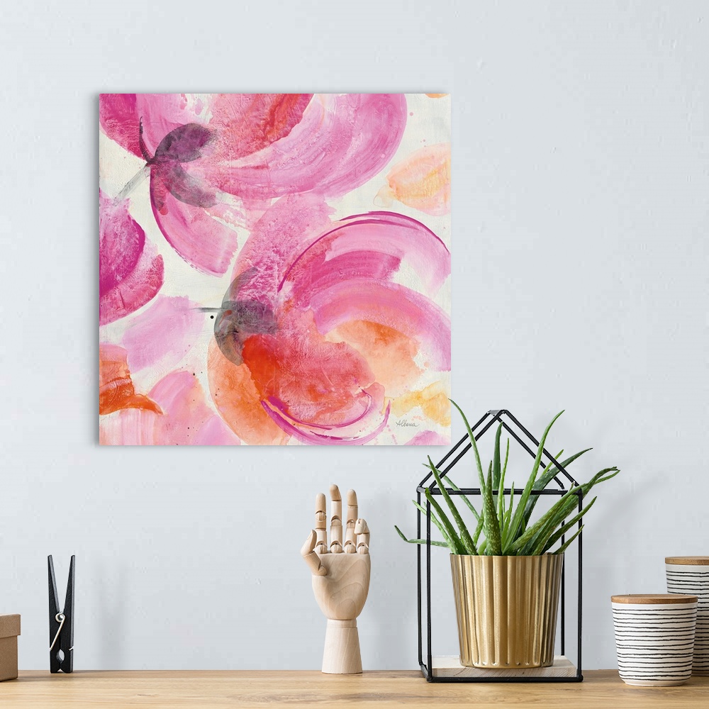 A bohemian room featuring Square artwork of large, vibrant colored flowers in pink and orange.