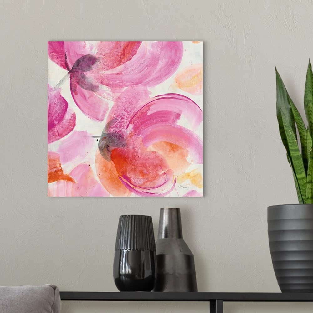 A modern room featuring Square artwork of large, vibrant colored flowers in pink and orange.