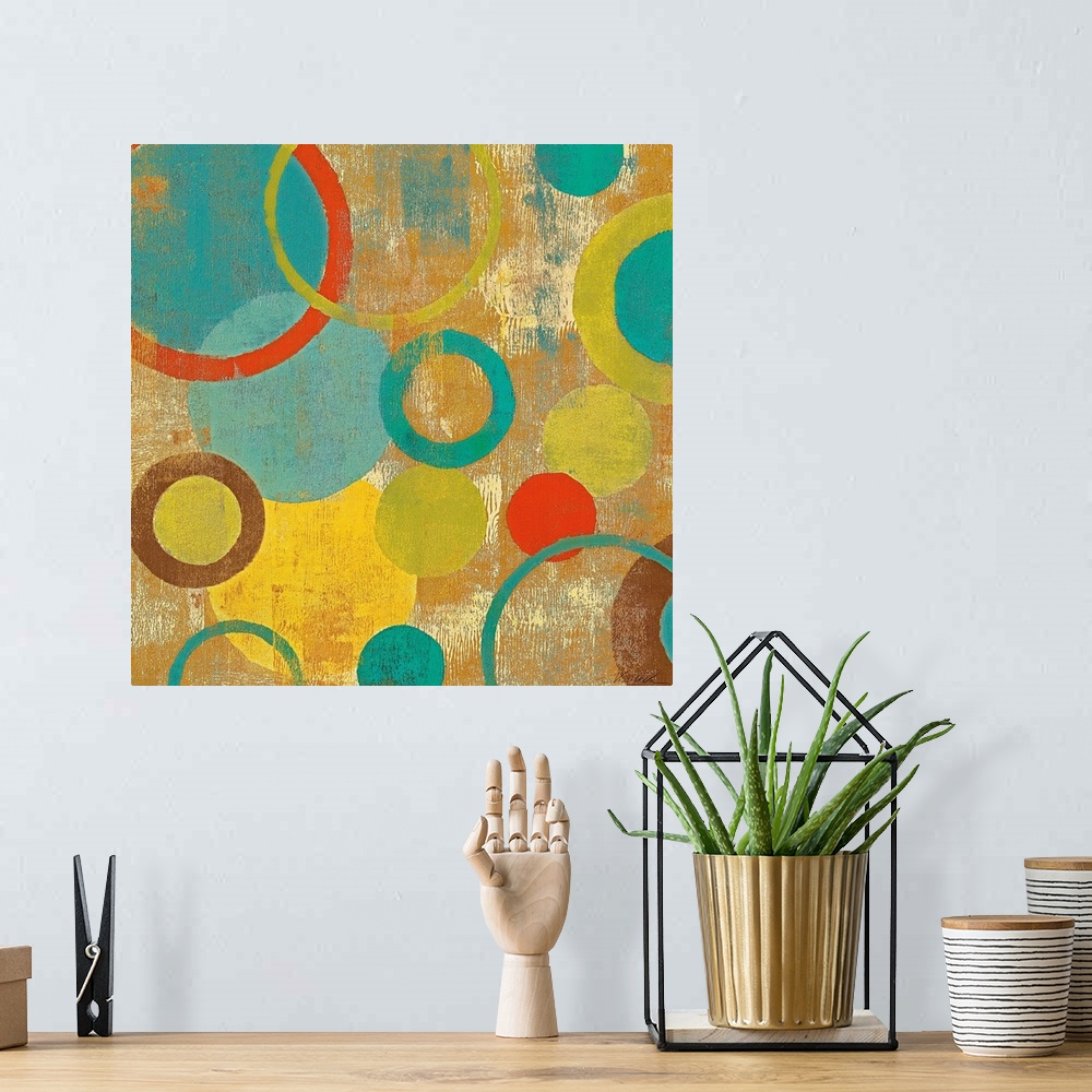 A bohemian room featuring Contemporary painting of overlapping circles and loops varying in color and size on an abstract b...