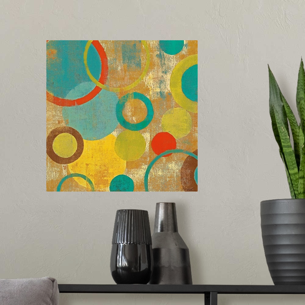 A modern room featuring Contemporary painting of overlapping circles and loops varying in color and size on an abstract b...