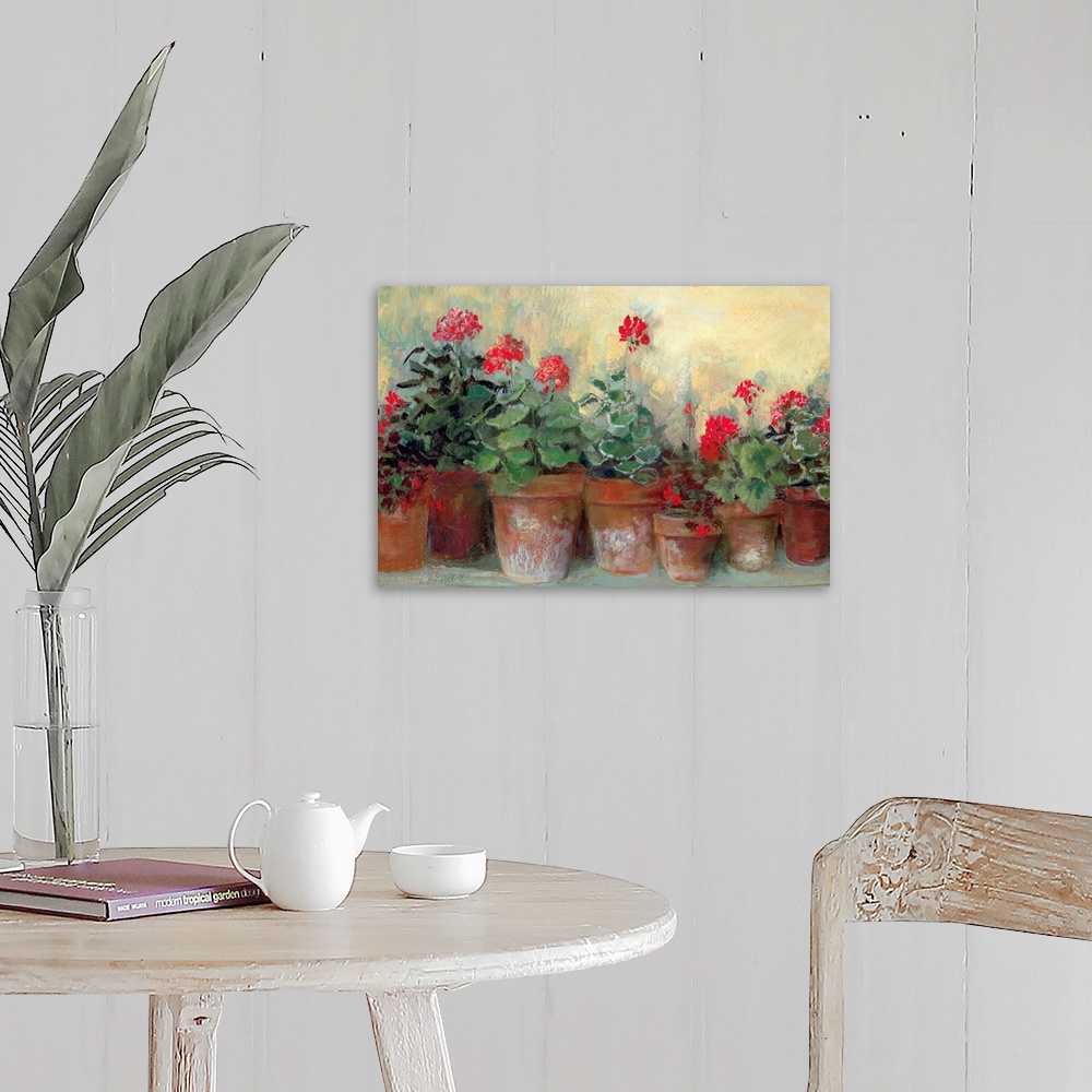 A farmhouse room featuring Painting of a row of flower pots varying in size.  Each flower pot contains bold colored flowers ...