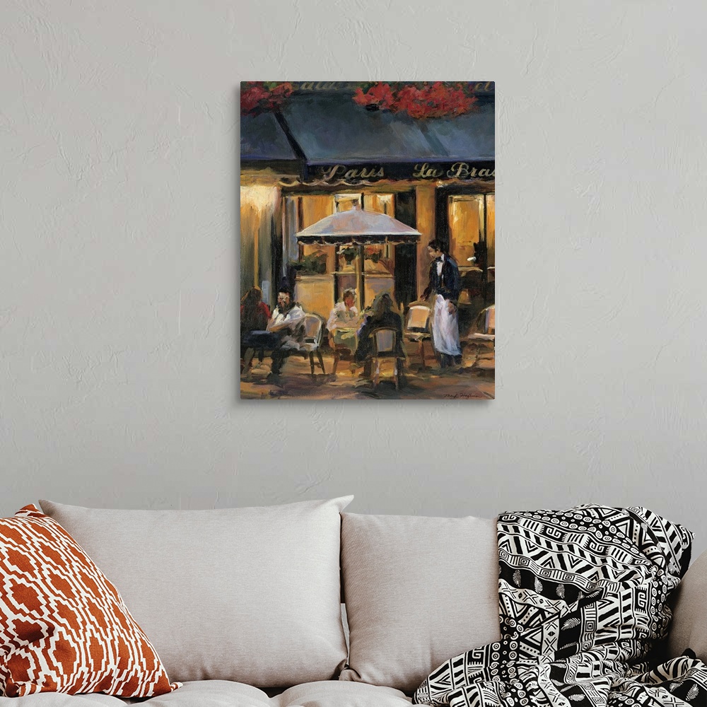 A bohemian room featuring Painting of street cafo with people sitting outside at tables at night with waiter attending to t...