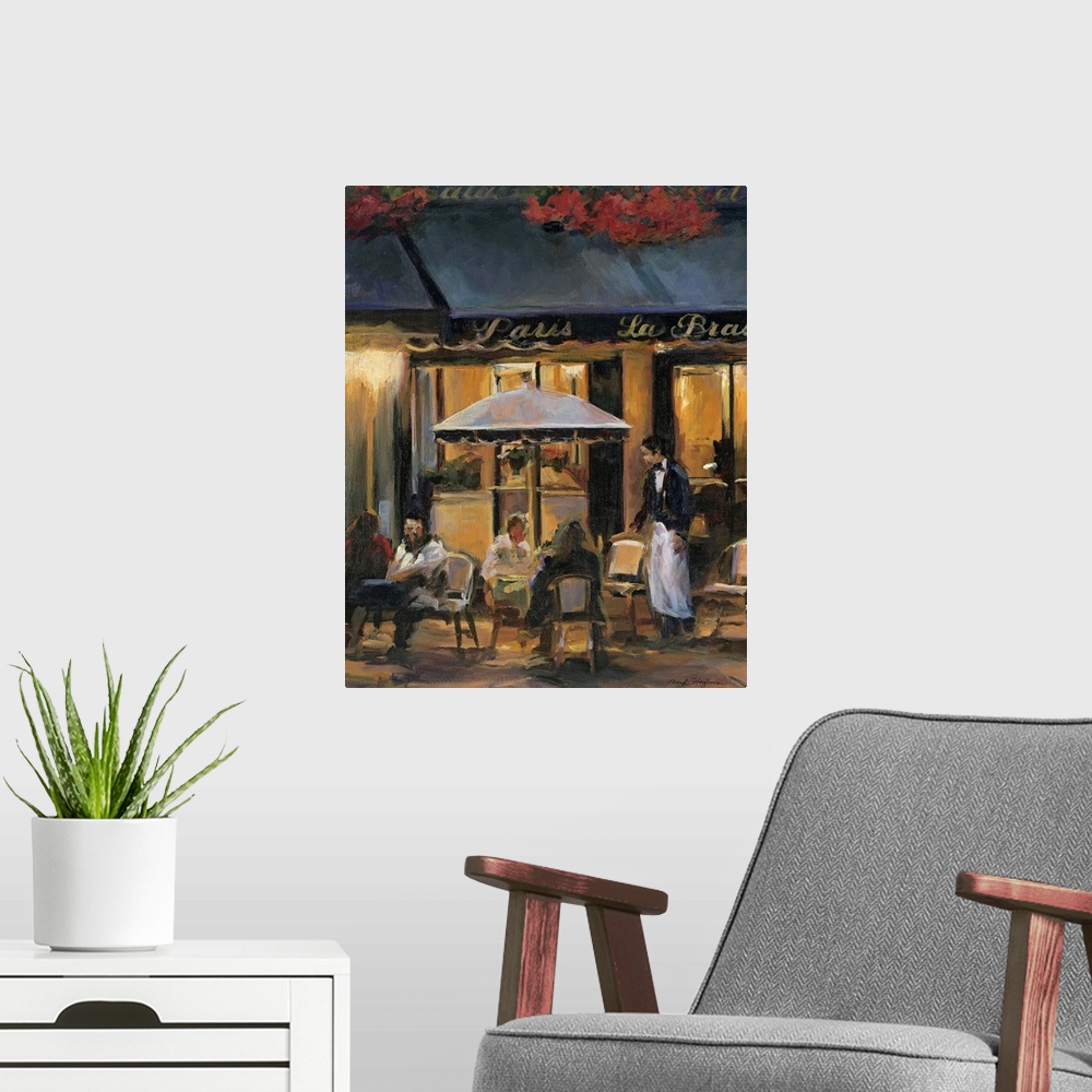 A modern room featuring Painting of street cafo with people sitting outside at tables at night with waiter attending to t...