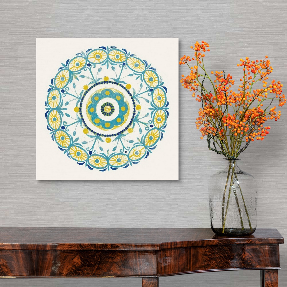 A traditional room featuring Square decor with a mandala design in the center made in shades of blue, green, and yellow on a w...