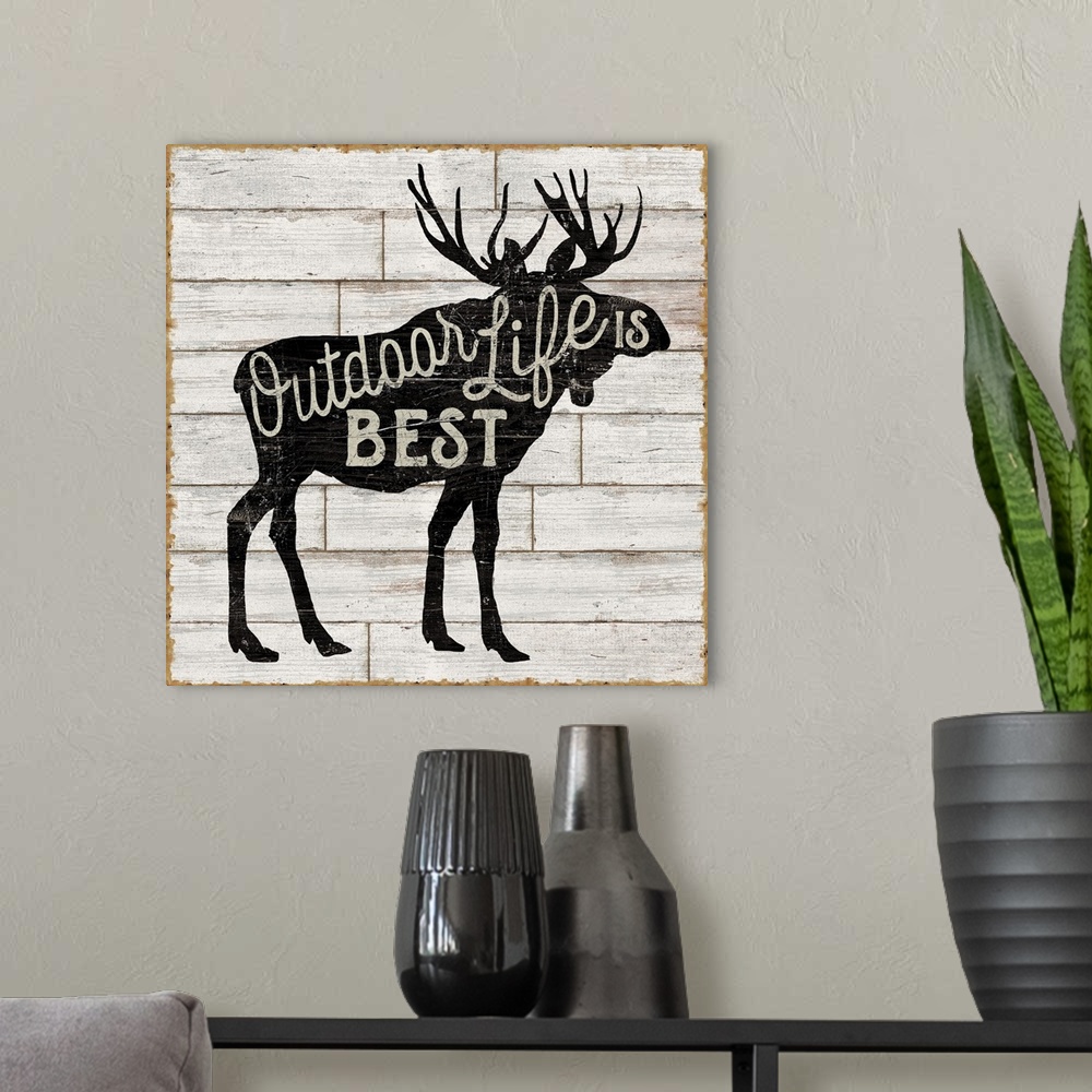 A modern room featuring Contemporary rustic cabin decor artwork of a silhouetted nature element with a typographic sentim...
