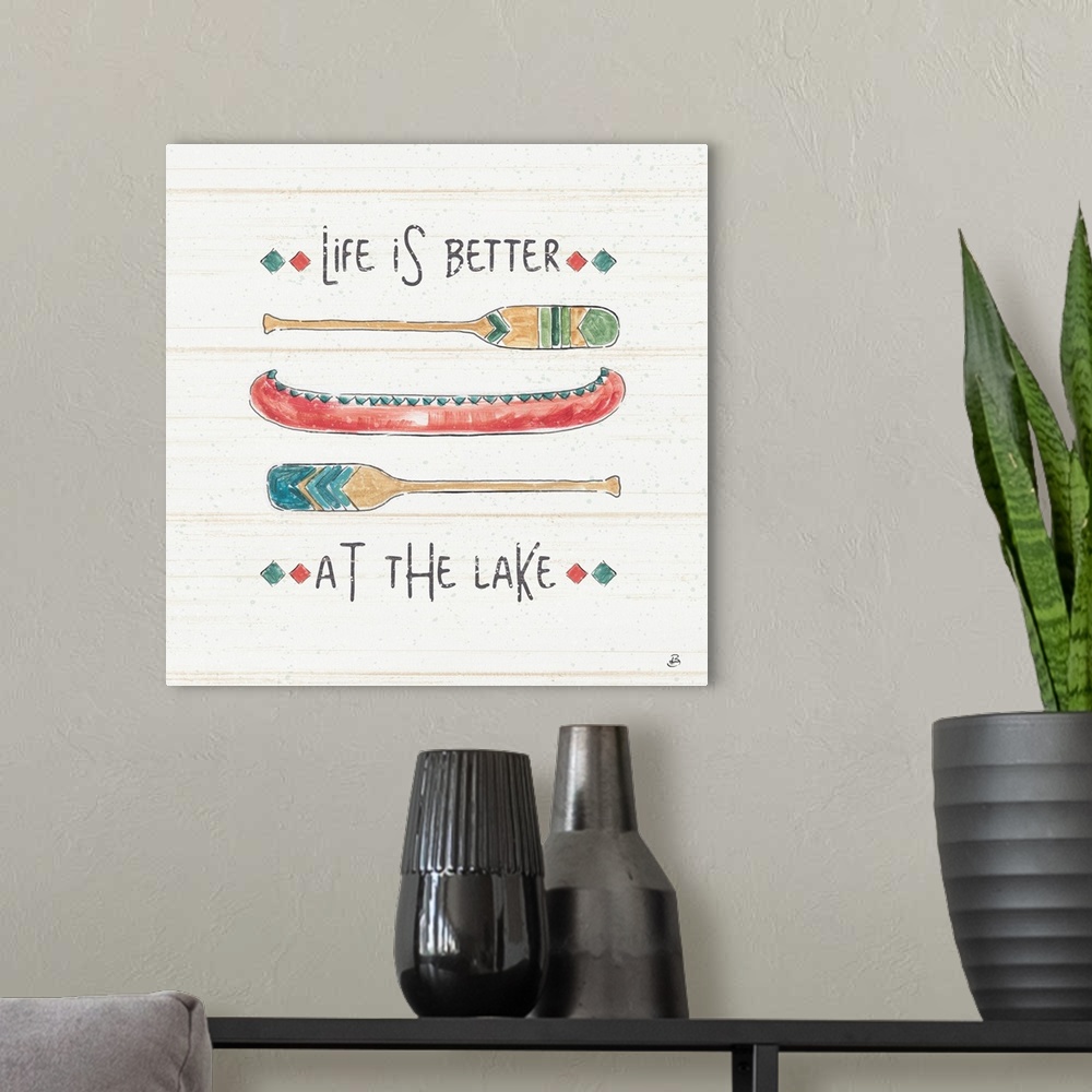 A modern room featuring A decorative design of a canoe and oars with the text "Life Is Better At The Lake".  There are fa...
