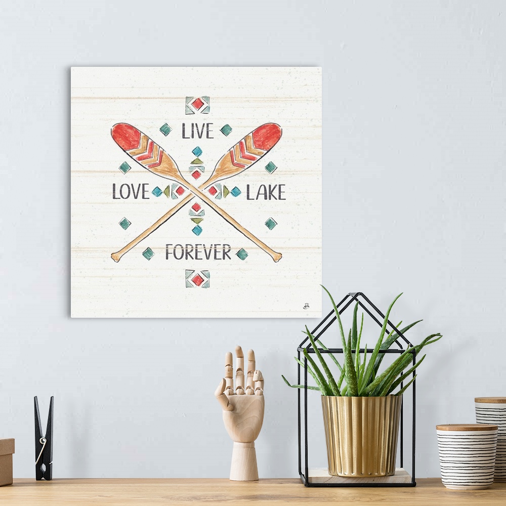 A bohemian room featuring A decorative design of oars crossing with the text "Live, Love, Lake, Forever".  There are faded ...