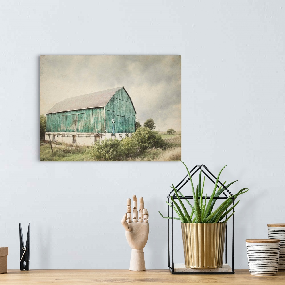 A bohemian room featuring Rustic photograph with distressed edges of an aged barn in a countryside landscape.