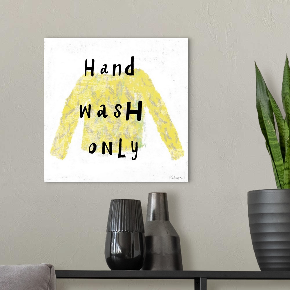 A modern room featuring "Hand Wash Only" square laundry room decor.