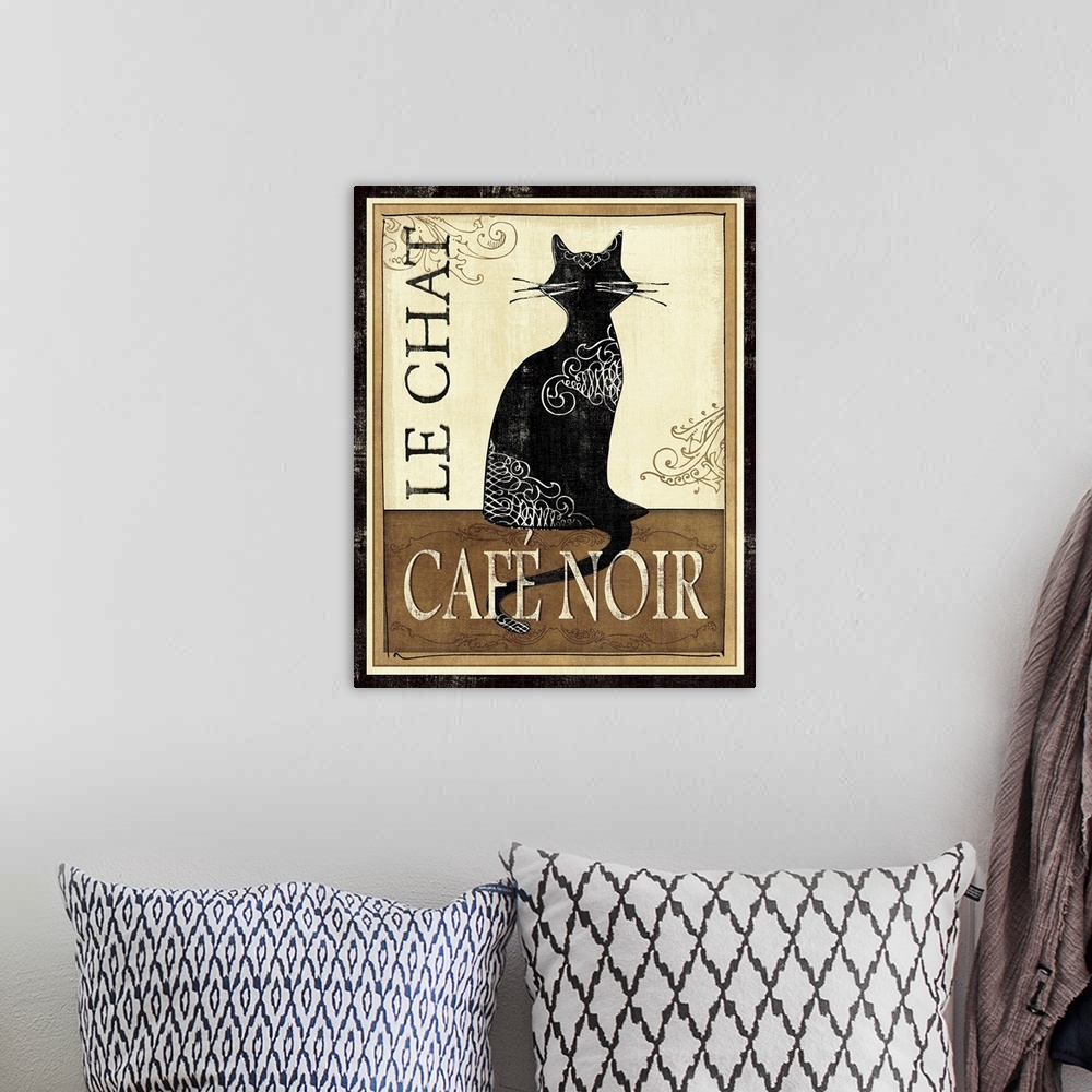 A bohemian room featuring Artwork with a cat's silhouette sitting on a table with the text "Cafo Noir" overlapping its tale...