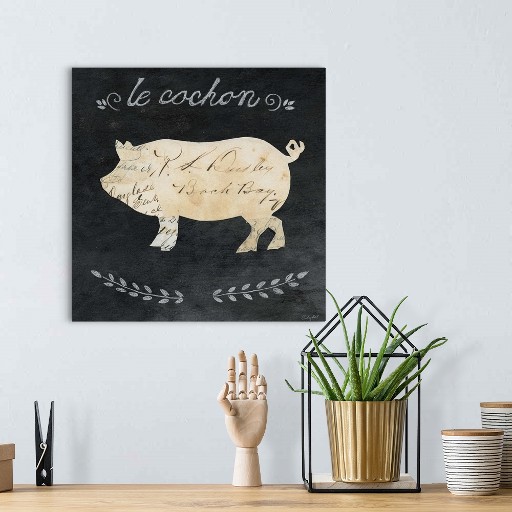A bohemian room featuring Artwork of a pig cameo against a chalkboard background.