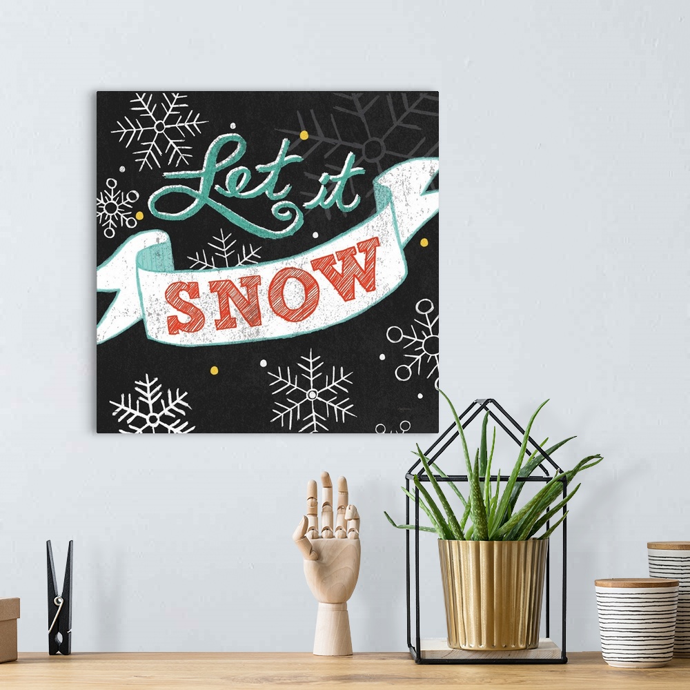 A bohemian room featuring "Let It Snow" on a black background with snowflakes.