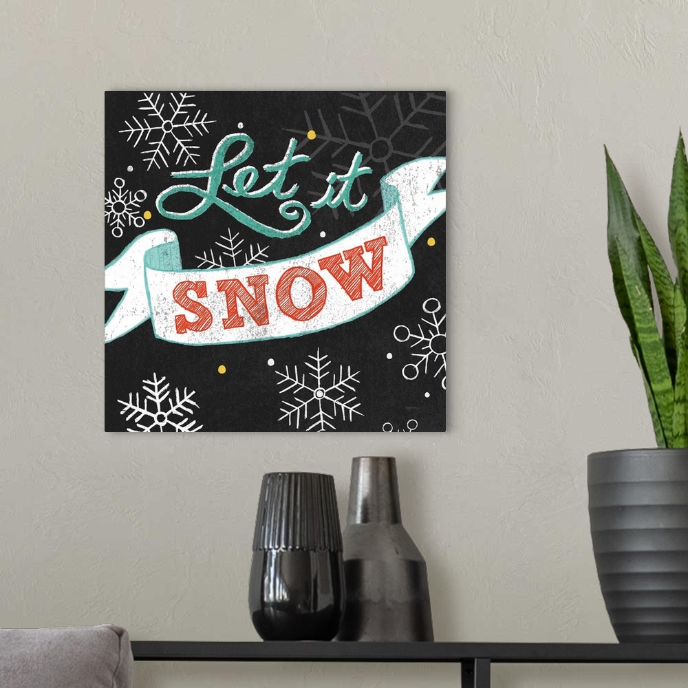 A modern room featuring "Let It Snow" on a black background with snowflakes.