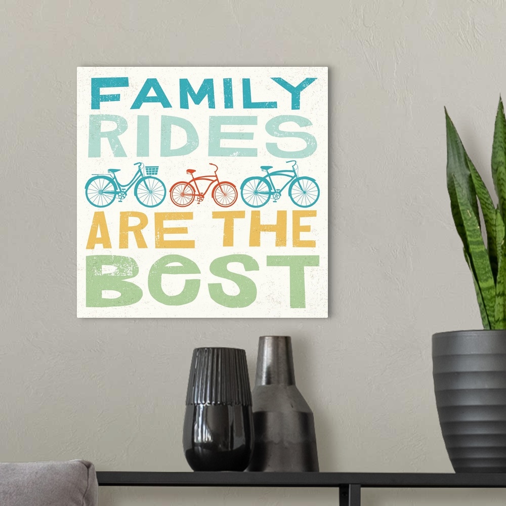 A modern room featuring "Family Rides are the Best" with illustrations of three bikes in the middle.
