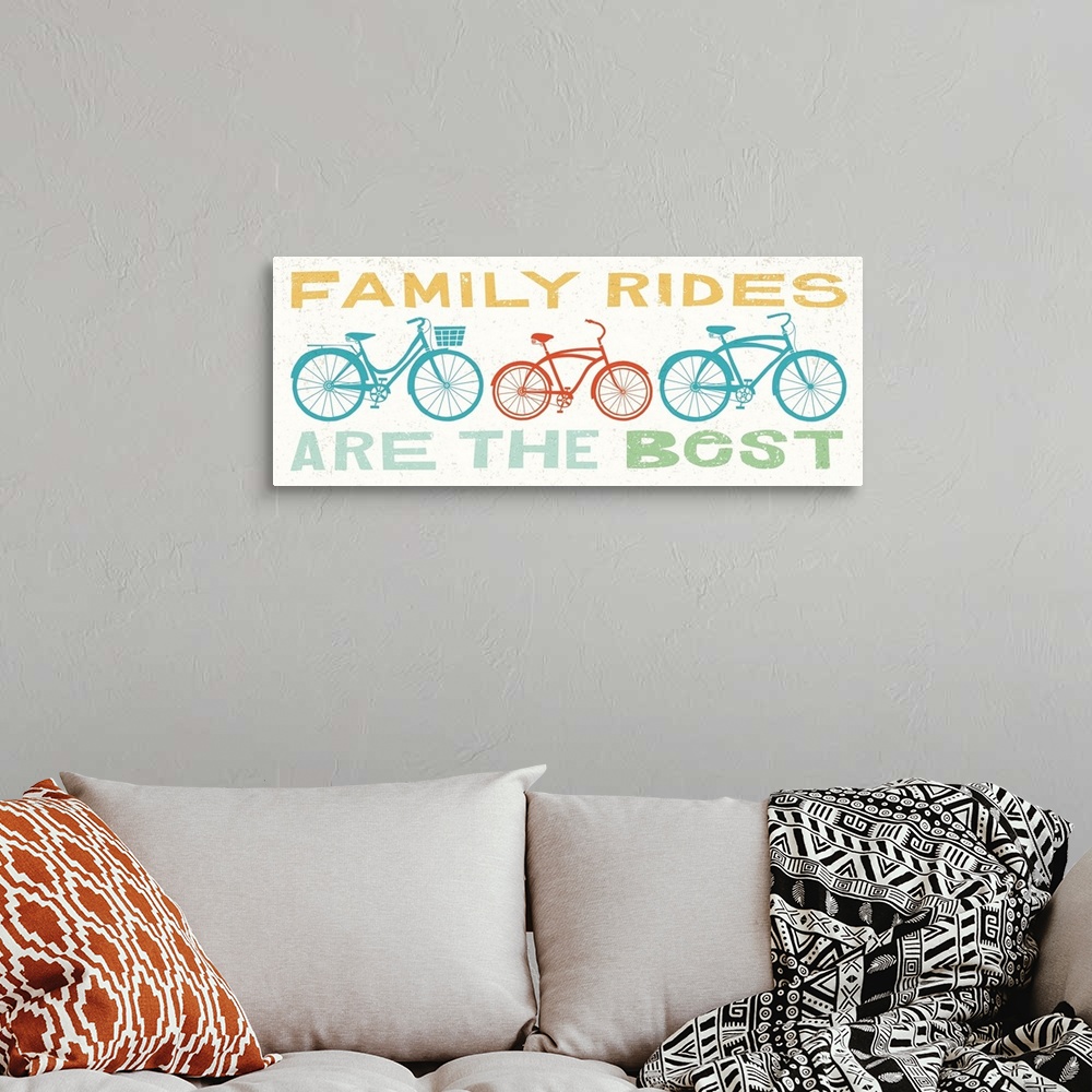 A bohemian room featuring "Family Rides are the Best" with illustrations of three bikes in the middle.