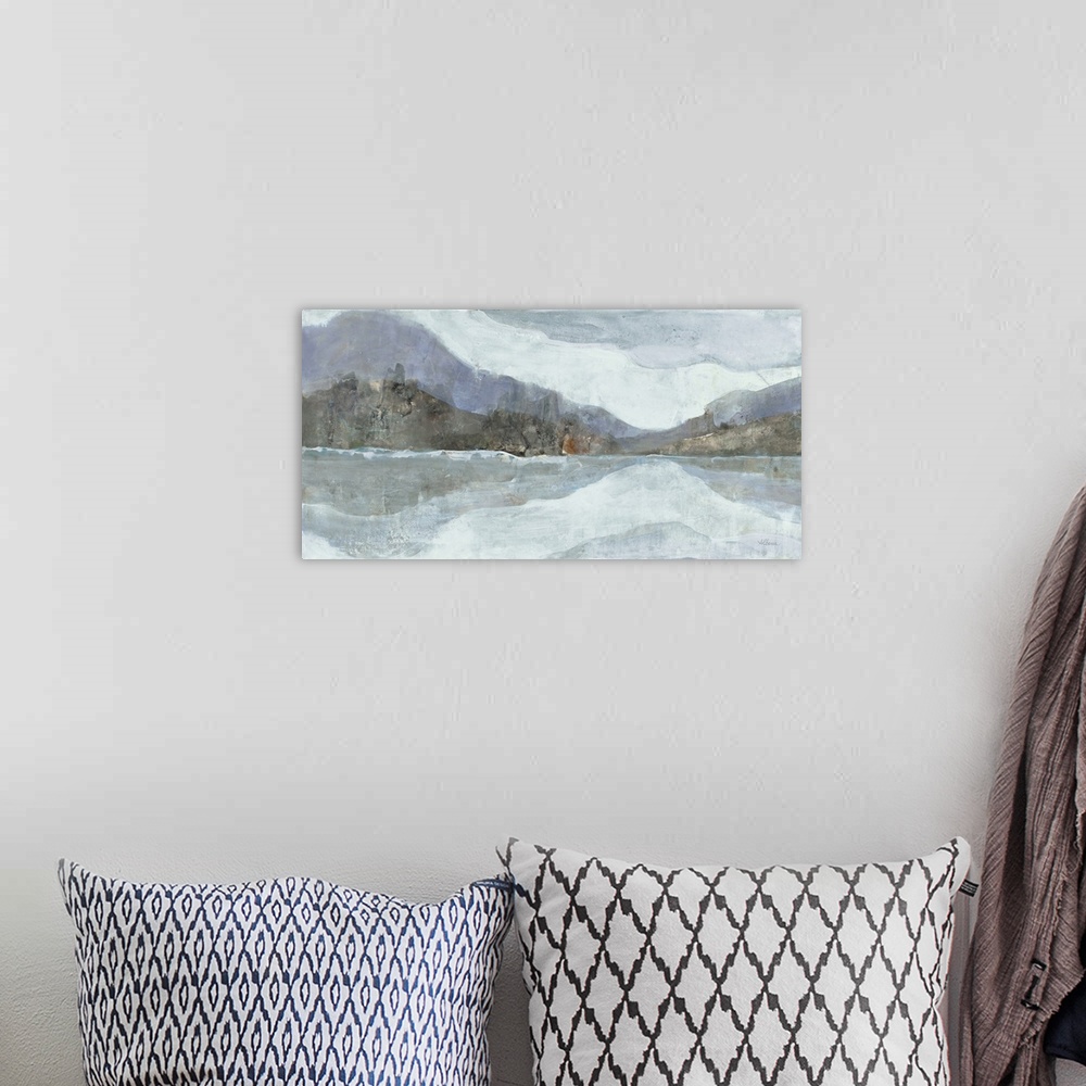 A bohemian room featuring Abstract painting of a mountainous Winter landscape with a lake in the foreground, in cool tones.
