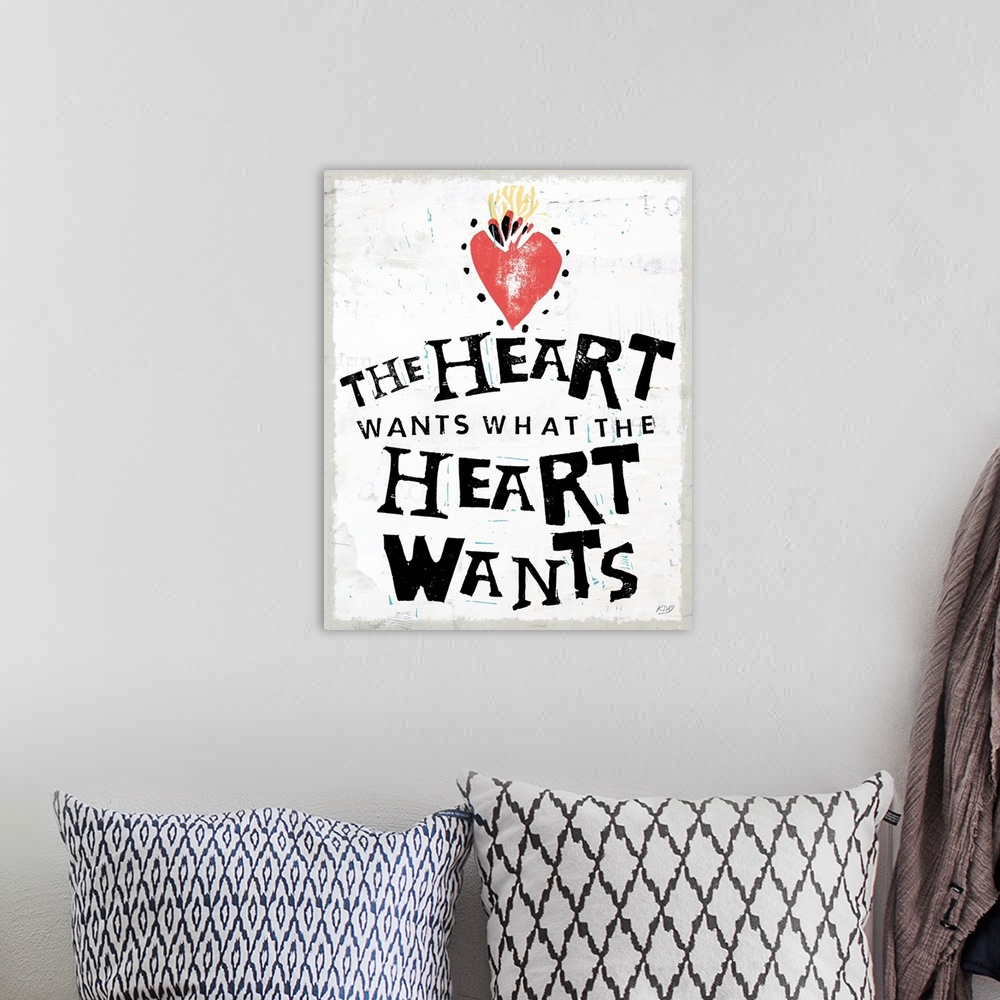 A bohemian room featuring Decorative art with the phrase "The Heart Wants What The Heart Wants" written in black with an il...