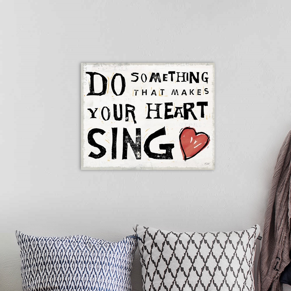 A bohemian room featuring Inspirational art with the quote "Do Something That Makes Your Heart Sing" written in black and w...