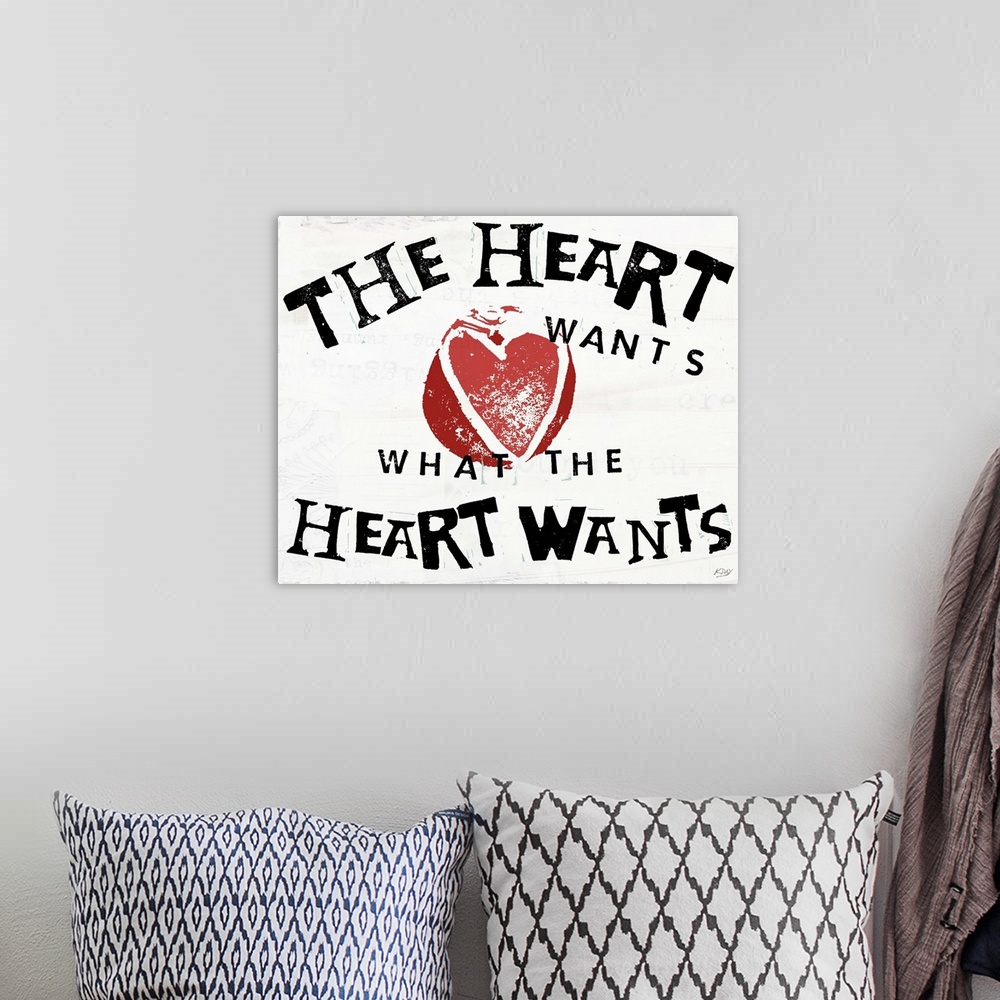 A bohemian room featuring Decorative art with the phrase "The Heart Wants What The Heart Wants" written in black with an il...