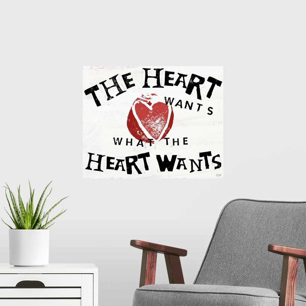 A modern room featuring Decorative art with the phrase "The Heart Wants What The Heart Wants" written in black with an il...