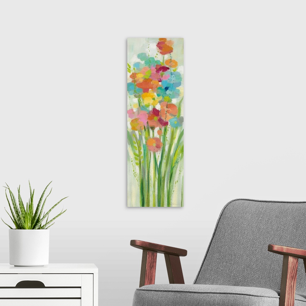 A modern room featuring A long vertical painting of a group of stemmed flowers and leaves in cheerful colors.