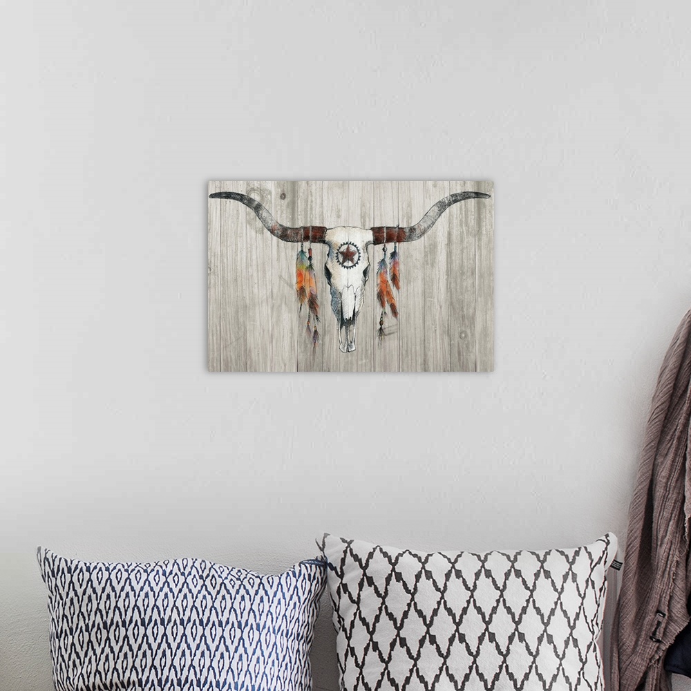 A bohemian room featuring Illustration of a longhorn skull with colorful feathers hanging from the horns on a rustic wooden...