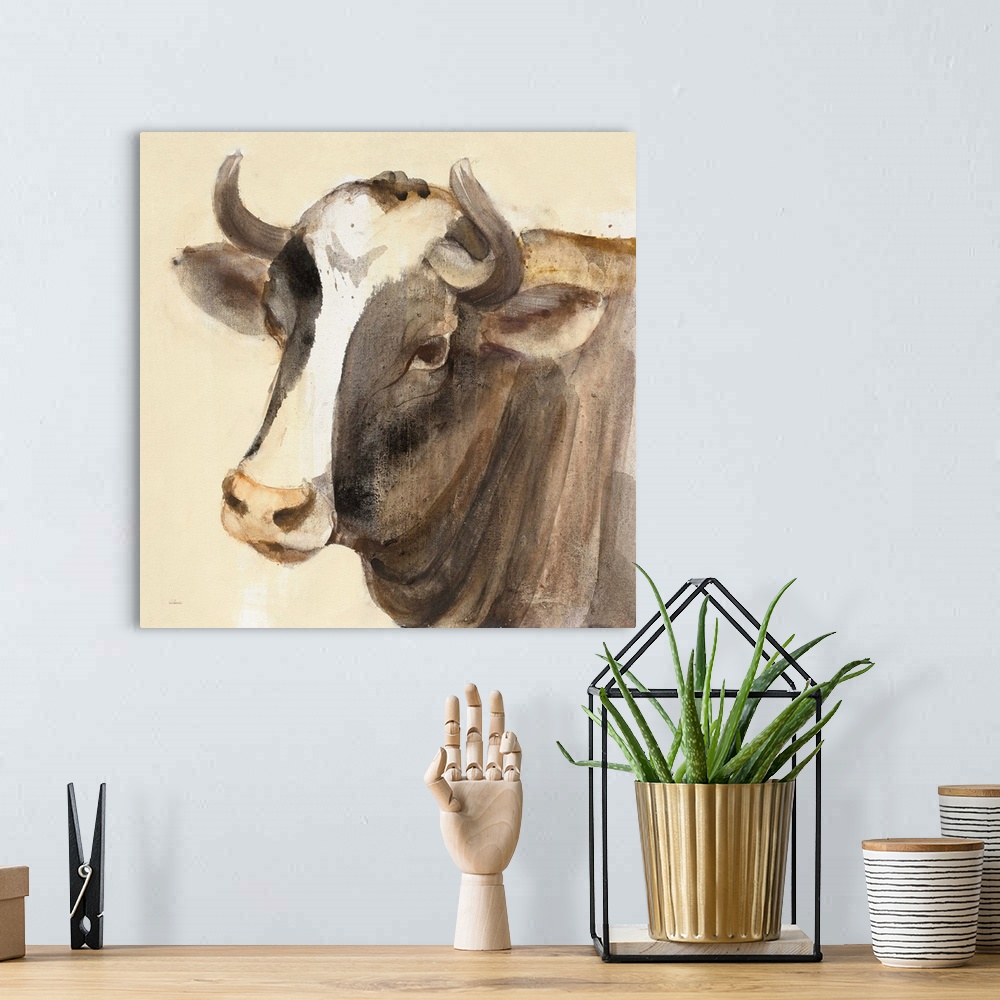 A bohemian room featuring Square contemporary painting of a bull in warm tones of color.