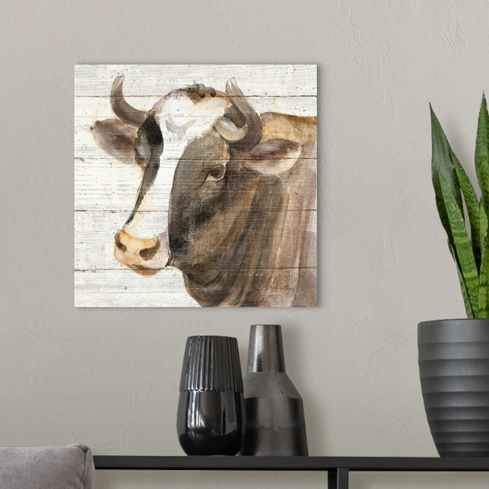 A modern room featuring Decorative rustic artwork of a cow portrait over a wood panel background.