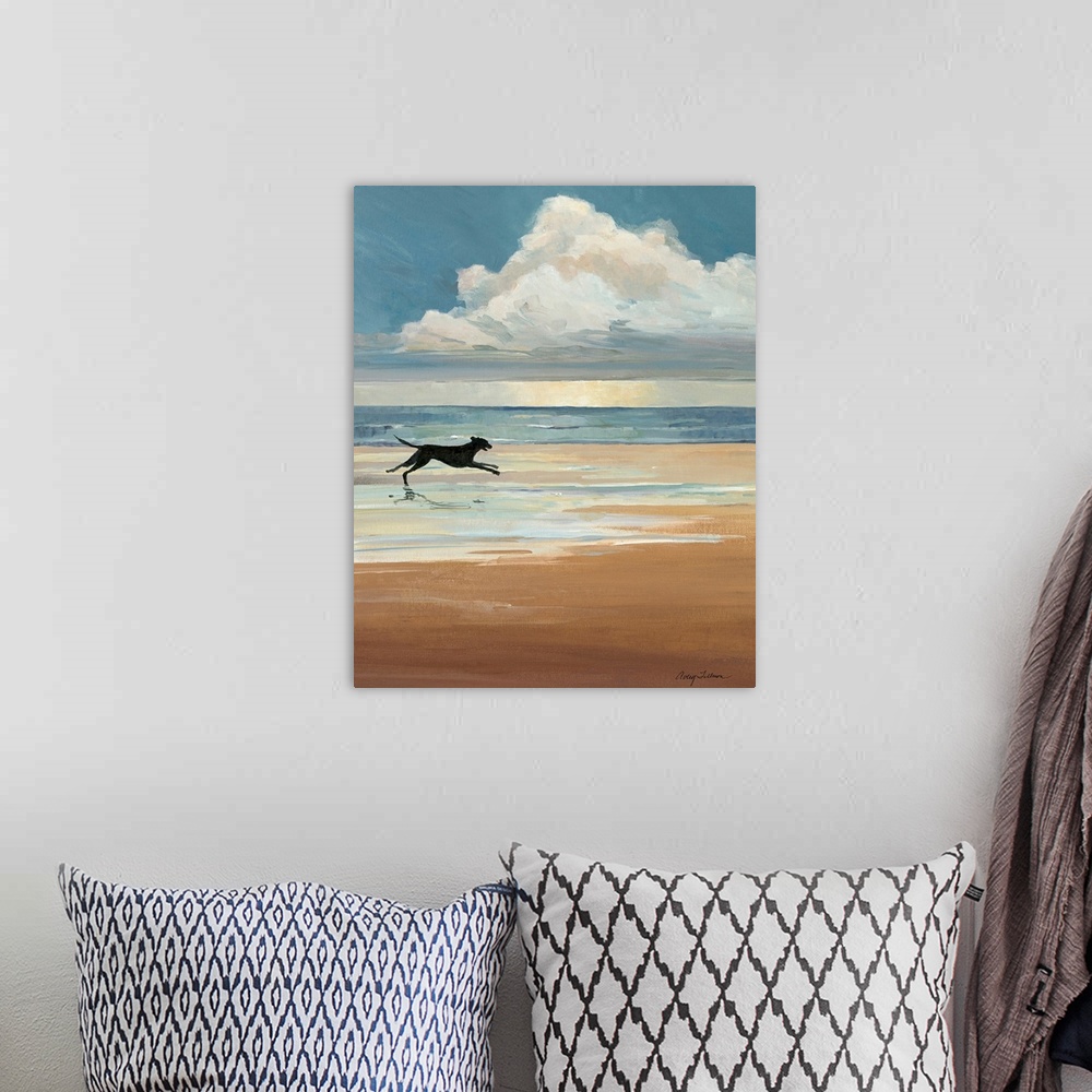 A bohemian room featuring A black Labrador runs on a sandy beach with a large cloud on the ocean horizon in this vertical l...