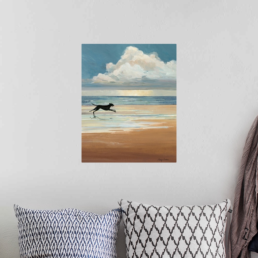 A bohemian room featuring A black Labrador runs on a sandy beach with a large cloud on the ocean horizon in this vertical l...