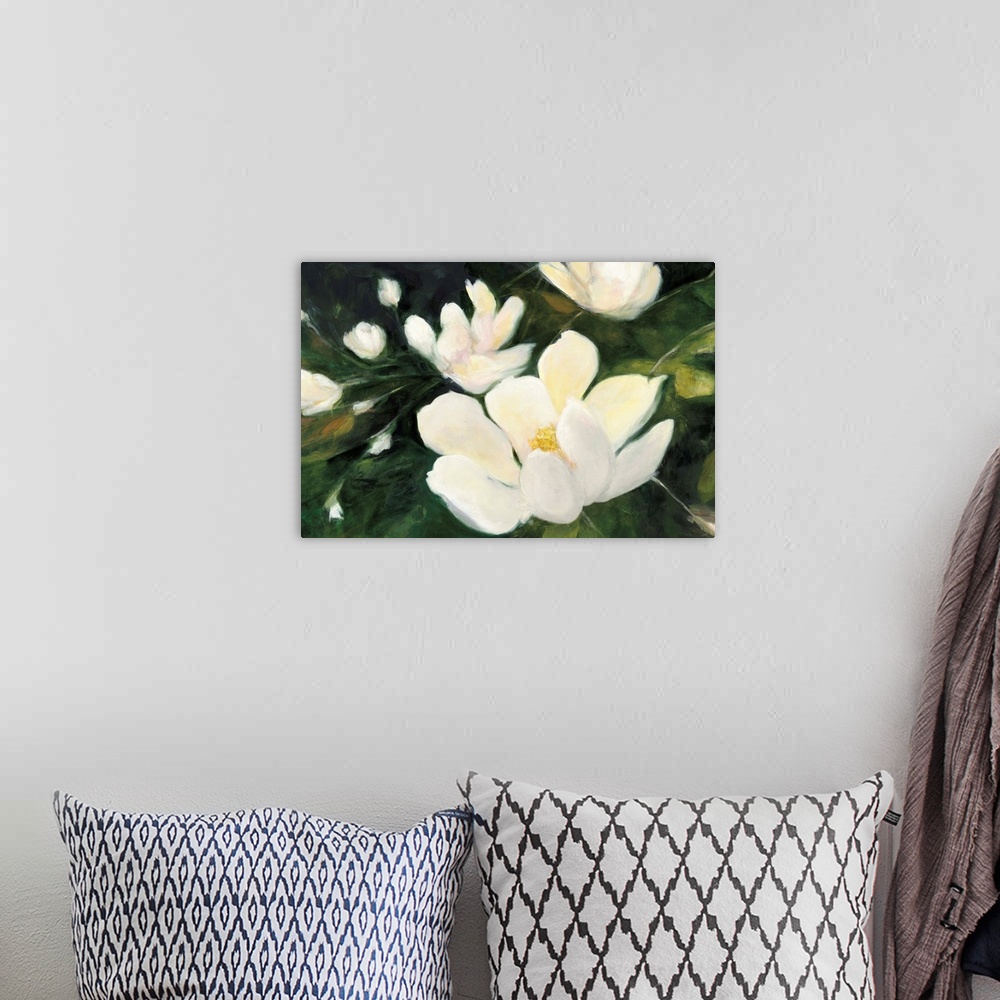 A bohemian room featuring Abstract painting of white magnolia flowers and buds on a dark green background.