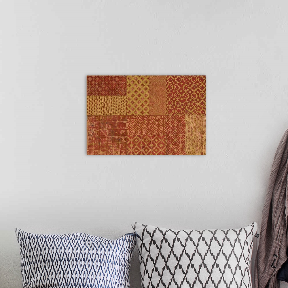 A bohemian room featuring A decorative image of shapes and patterns within rectangle sections in gold and orange.