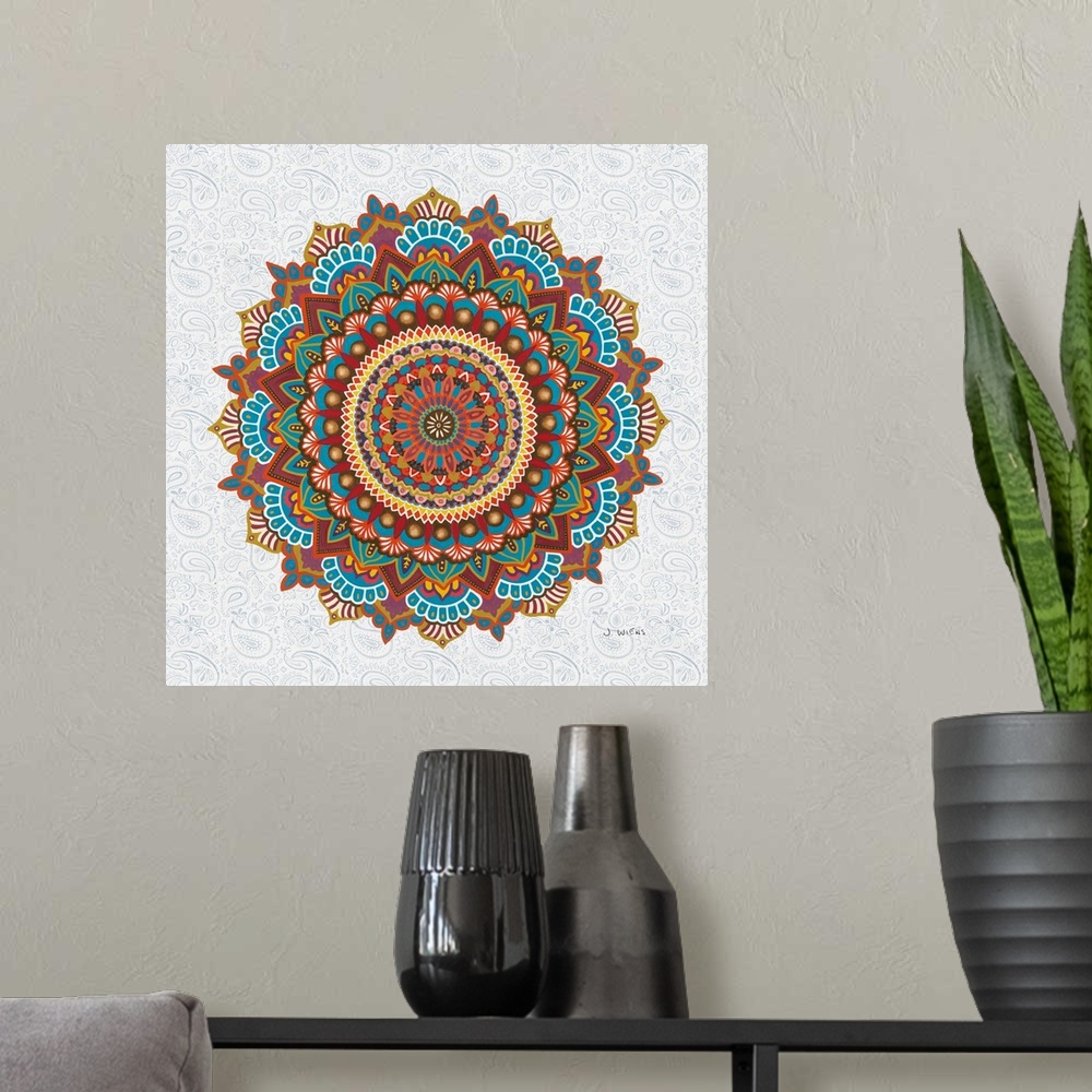 A modern room featuring A beautifully colored mandala design in warm tones on a paisley patterned background.