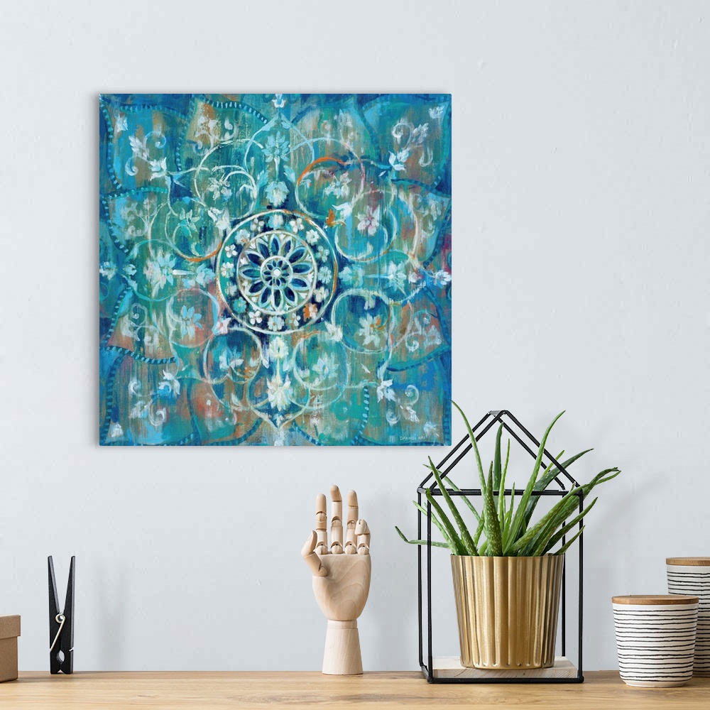 A bohemian room featuring Contemporary artwork of a mandala using predominantly blue.