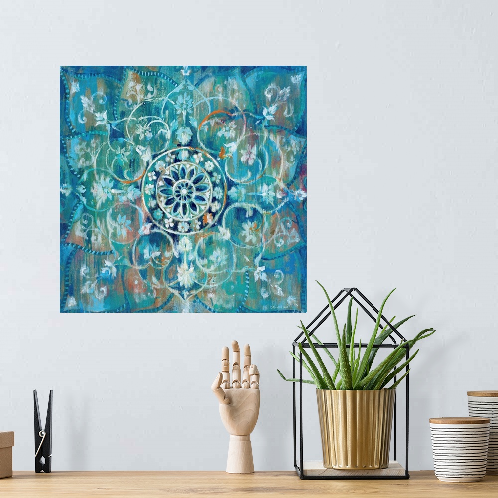 A bohemian room featuring Contemporary artwork of a mandala using predominantly blue.