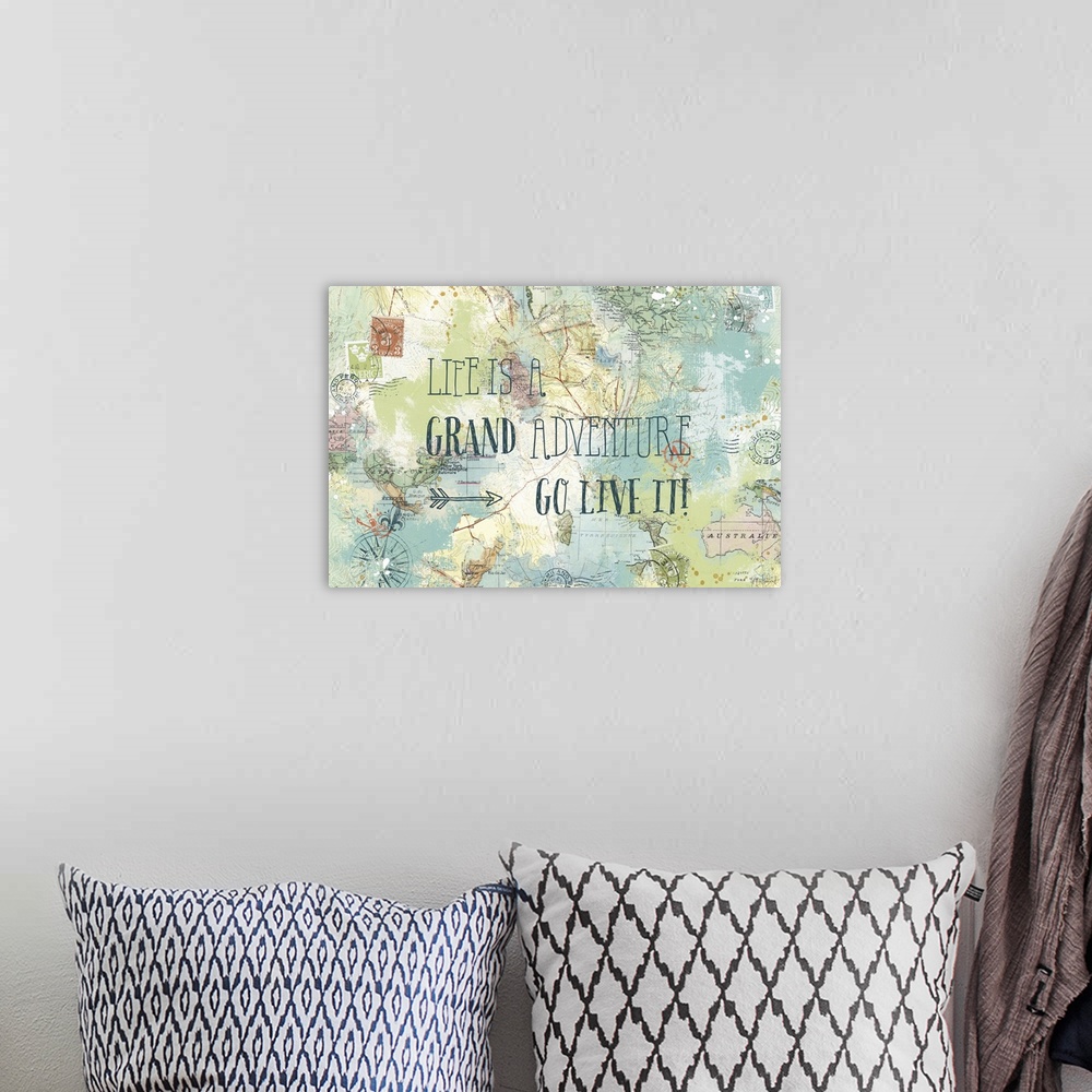 A bohemian room featuring "Life is a Grand Adventure, Go Live It!" written on top of a map and postage stamp collage.